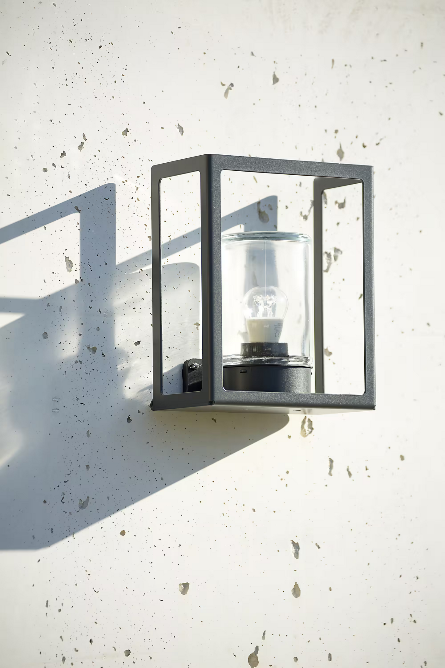Hugy Clear Glass Decorative Multi-Position Light with Cut-Out and bent Aluminium Body
