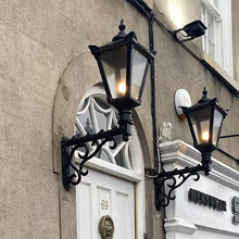 Victorian traditional cast iron wall light with decorative arm 1.1m
